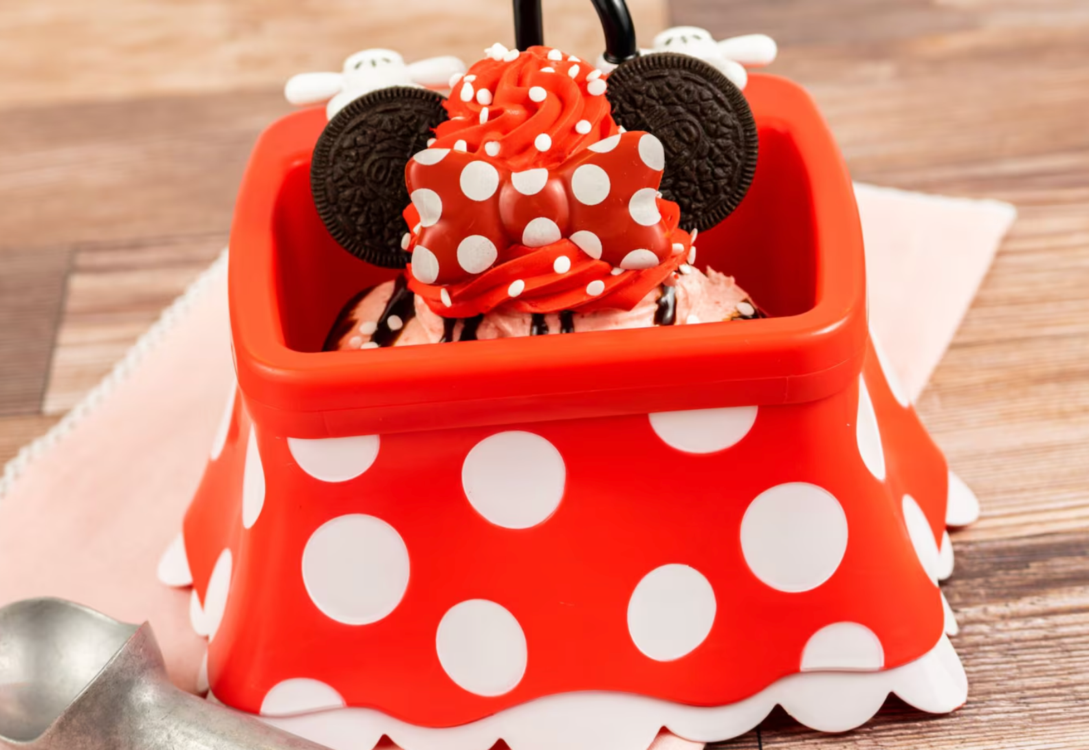 Polka dot themed dessert bowl with Mickey ears decoration in red and white.