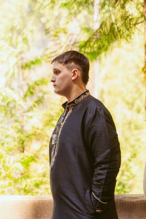 A series of profile views showing someone in a dark jacket against a sunlit forest background.