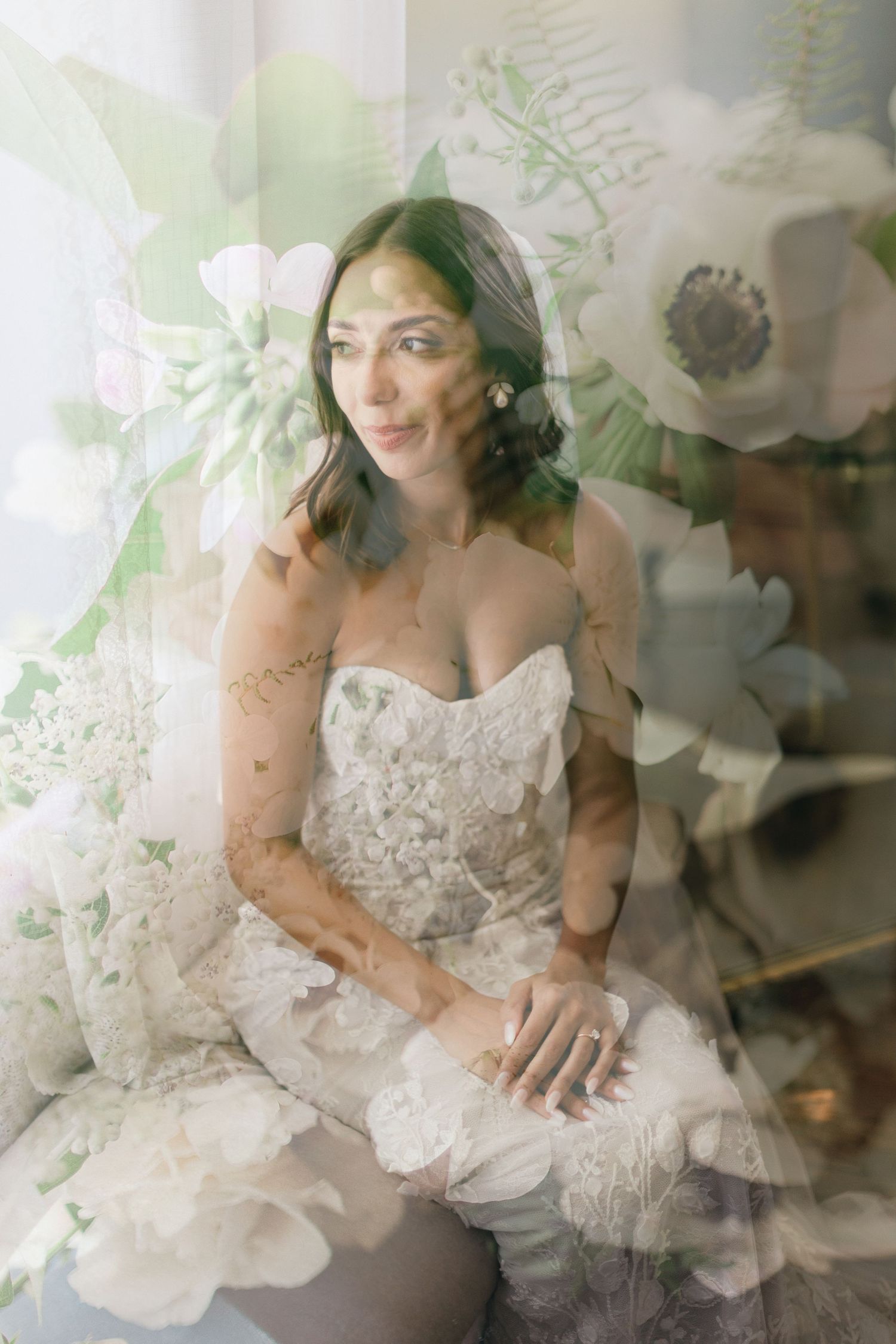 A series of reflective shots showing a person in a white lace wedding dress posing in front of octagonal mirrors.