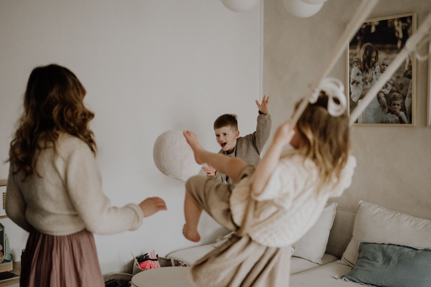 A series of candid photos showing people dancing and celebrating in a bright white room with casual attire.
