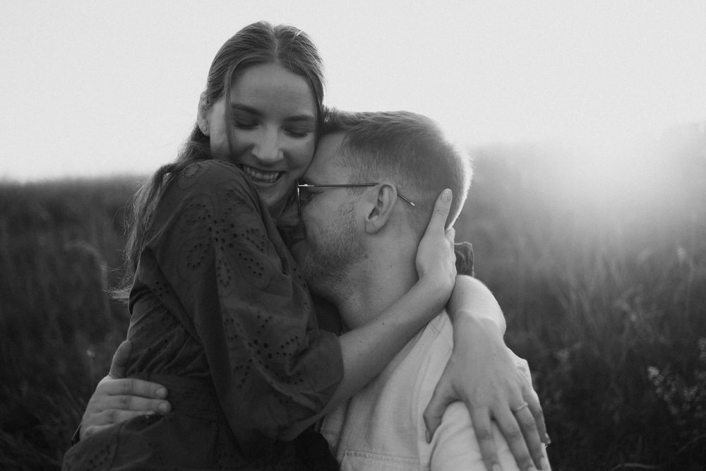 Intimate black and white portrait series showing tender moments between a couple.