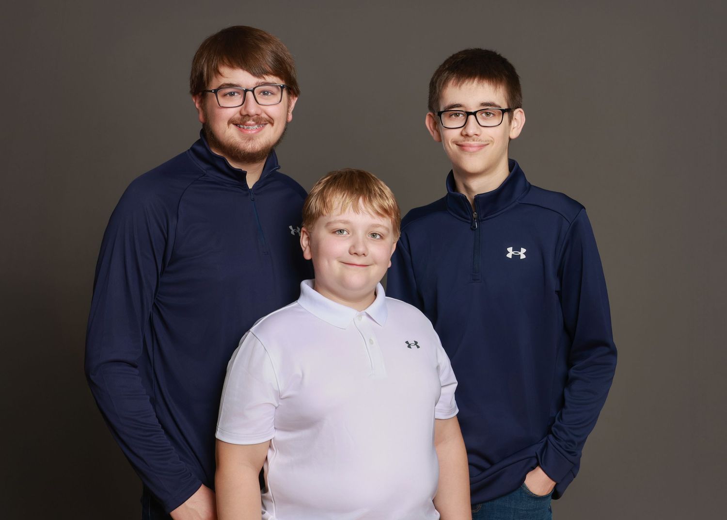 Candid family moment captured in calm, natural-light studio setup
