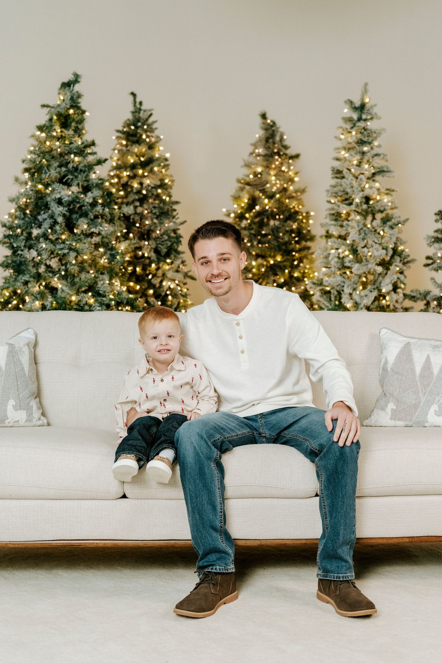A series of holiday photos showing a white couch against decorated Christmas trees with twinkling lights in the background.