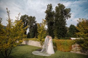 A series of wedding photos showing a couple in a beautiful outdoor garden setting with autumn trees and foliage.