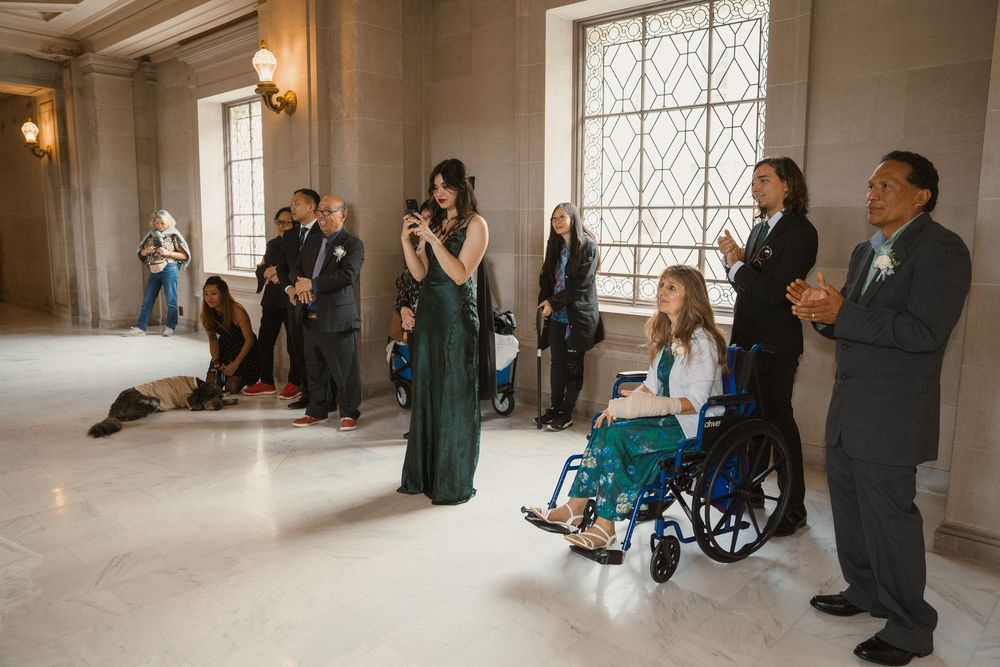 A sequence of wedding photos showing guests gathered in an elegant venue with ornate windows and decor.