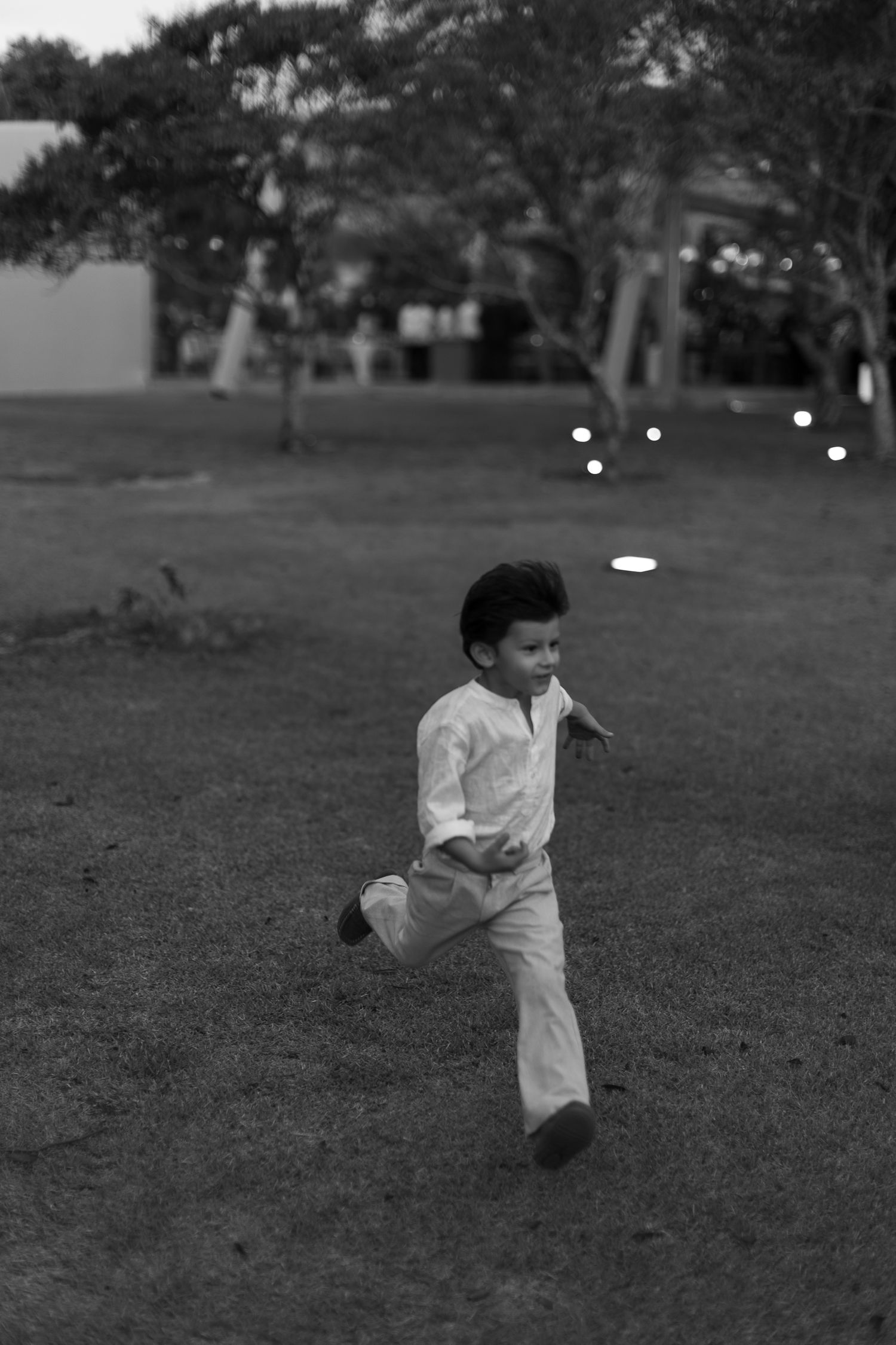 A series of black and white photos showing a person playing baseball in a grassy field.