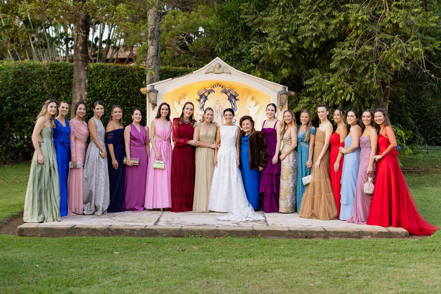 A series of outdoor group photos showing people in formal attire and colorful dresses standing together in garden settings.