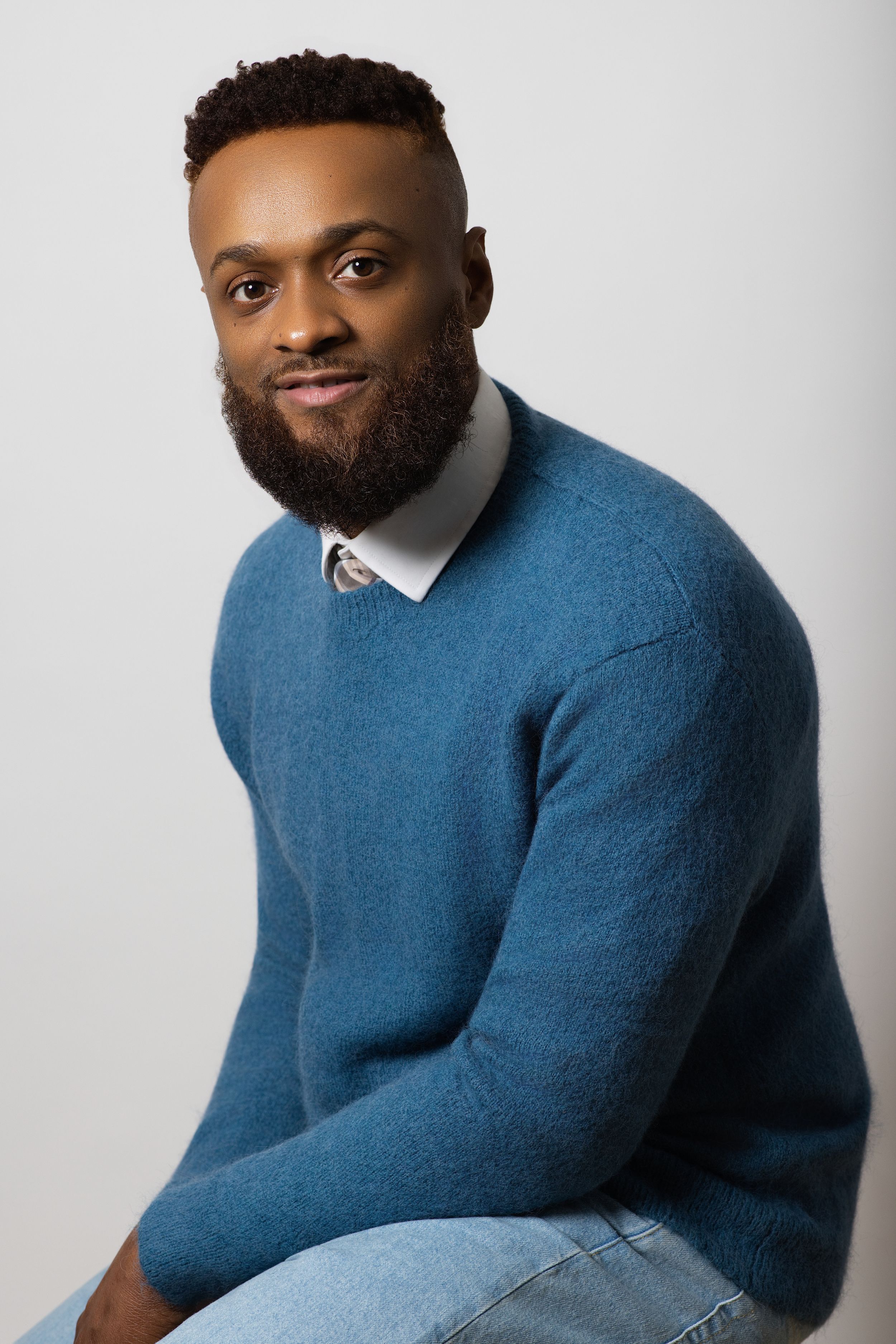 Portrait series showing someone in a blue sweater against white background.