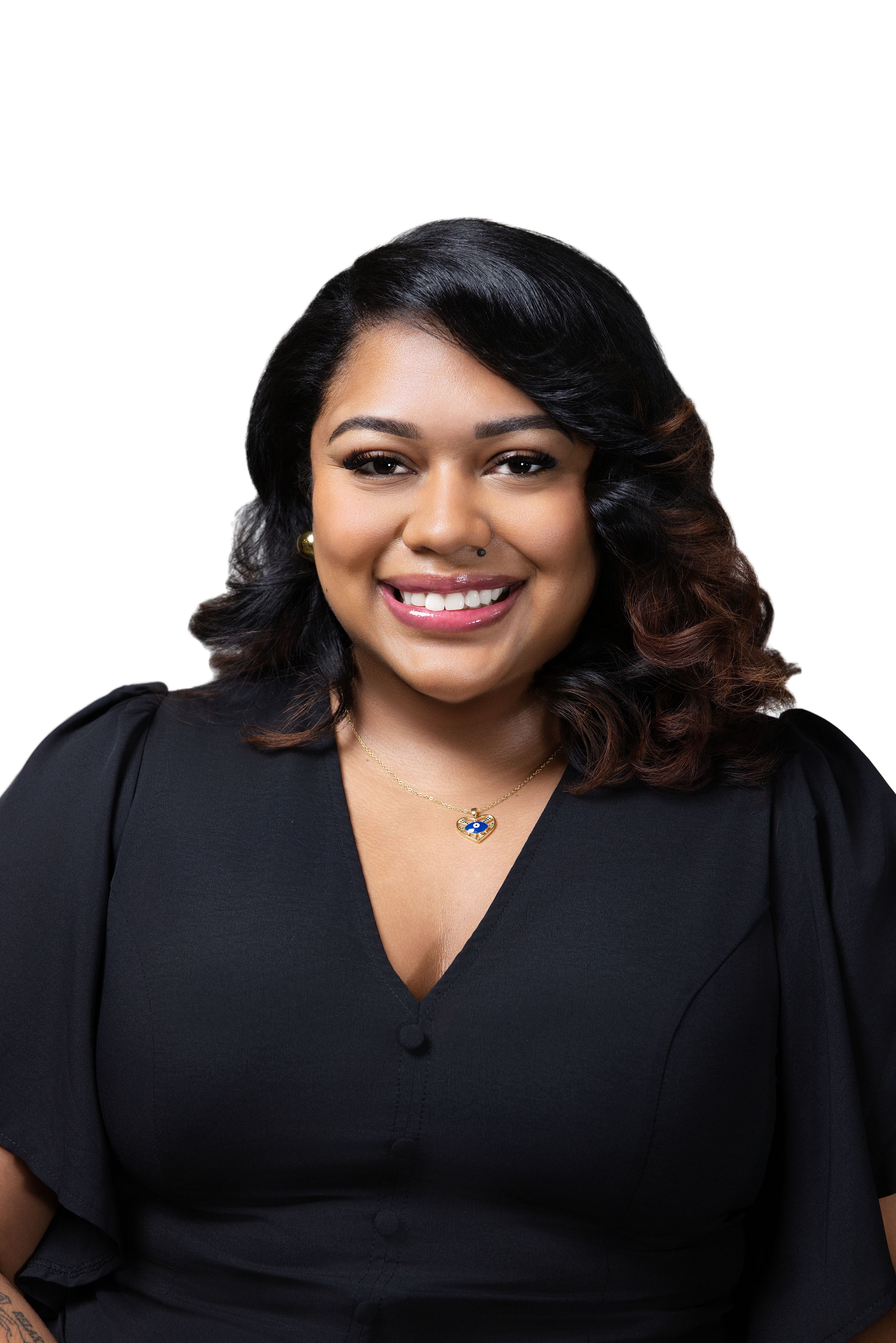 Professional headshot in black v-neck blouse against neutral studio backdrop.