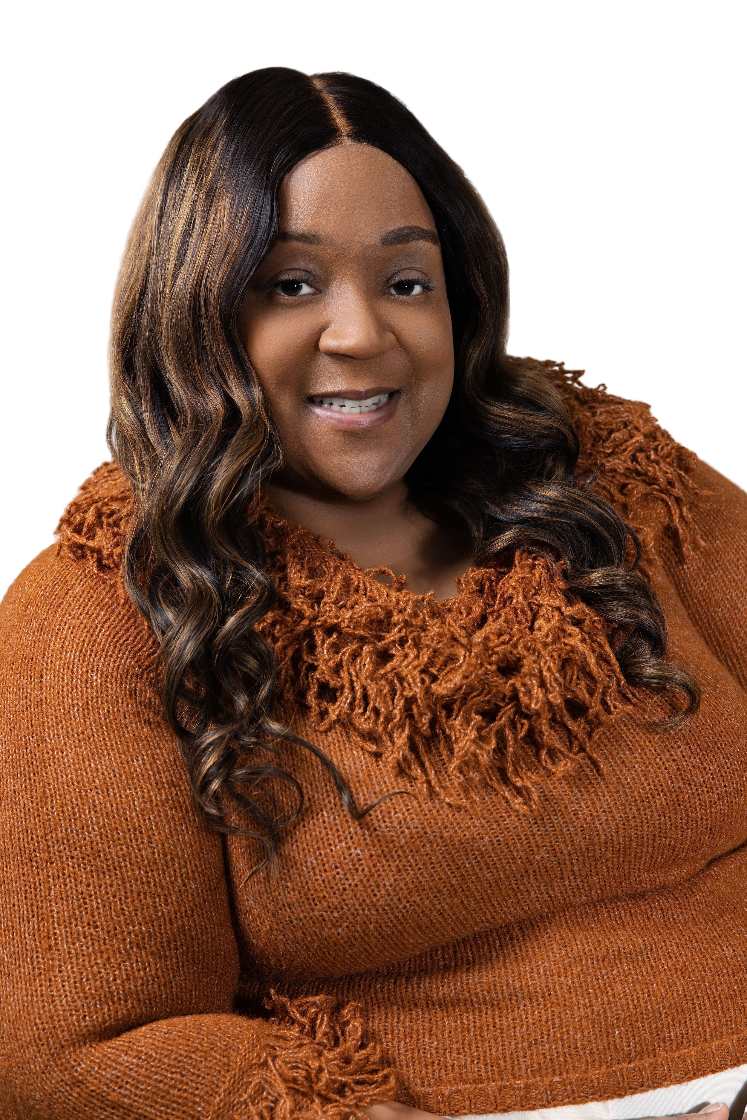 Cozy portrait in rust-colored knit sweater with textured fringe collar detail.