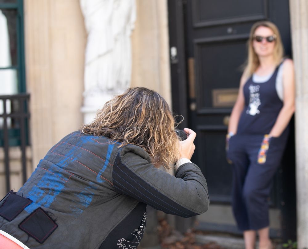 Helen Yandell capturing personal brand lifestyle portraits outdoors in Worcestershire, showing behind-the-scenes of a prof brand shoot