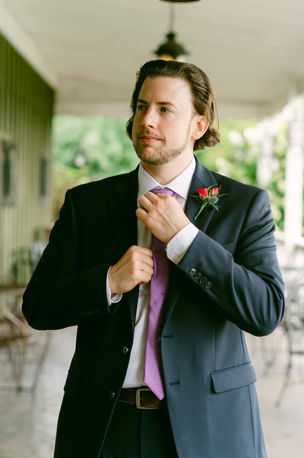 A sequence of photos shows someone in a dark suit and purple tie adjusting their collar and tie while standing outdoors.