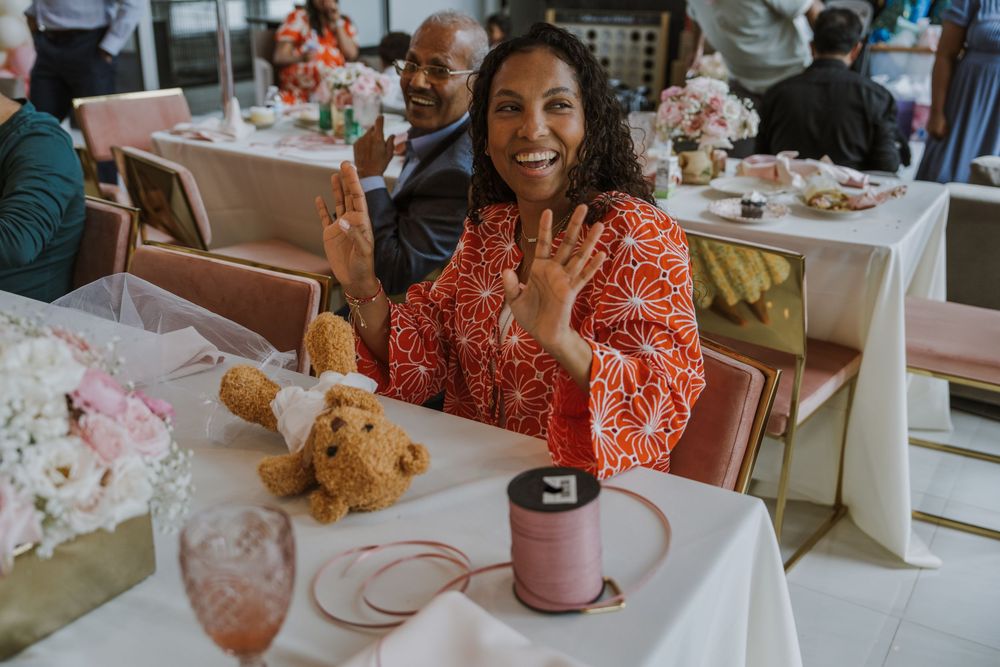 Festive baby shower celebration with table settings and decorative teddy bears.