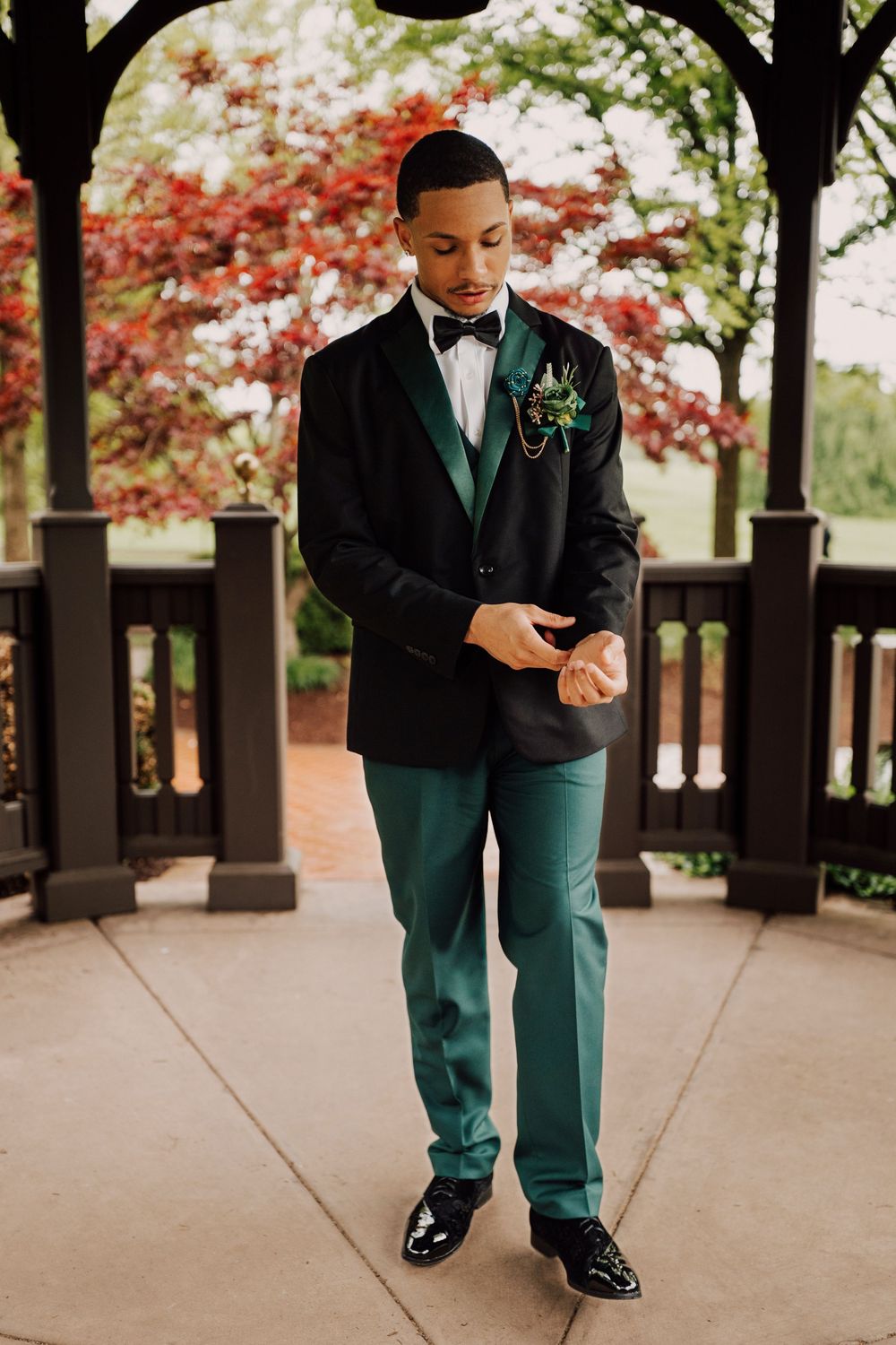 High school student wearing formal attire while standing in a gazebo for photoshoot in Hershey, PA.