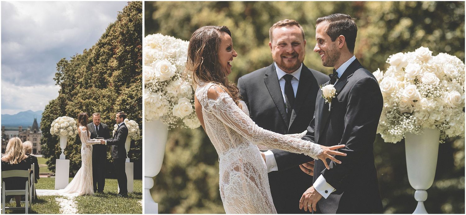A couple joyfully embraces during their outdoor wedding ceremony surrounded by blooming flowers.