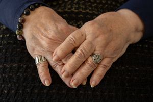 A series of close-up photos showing hands wearing ornate gold rings with detailed carvings and gem settings.