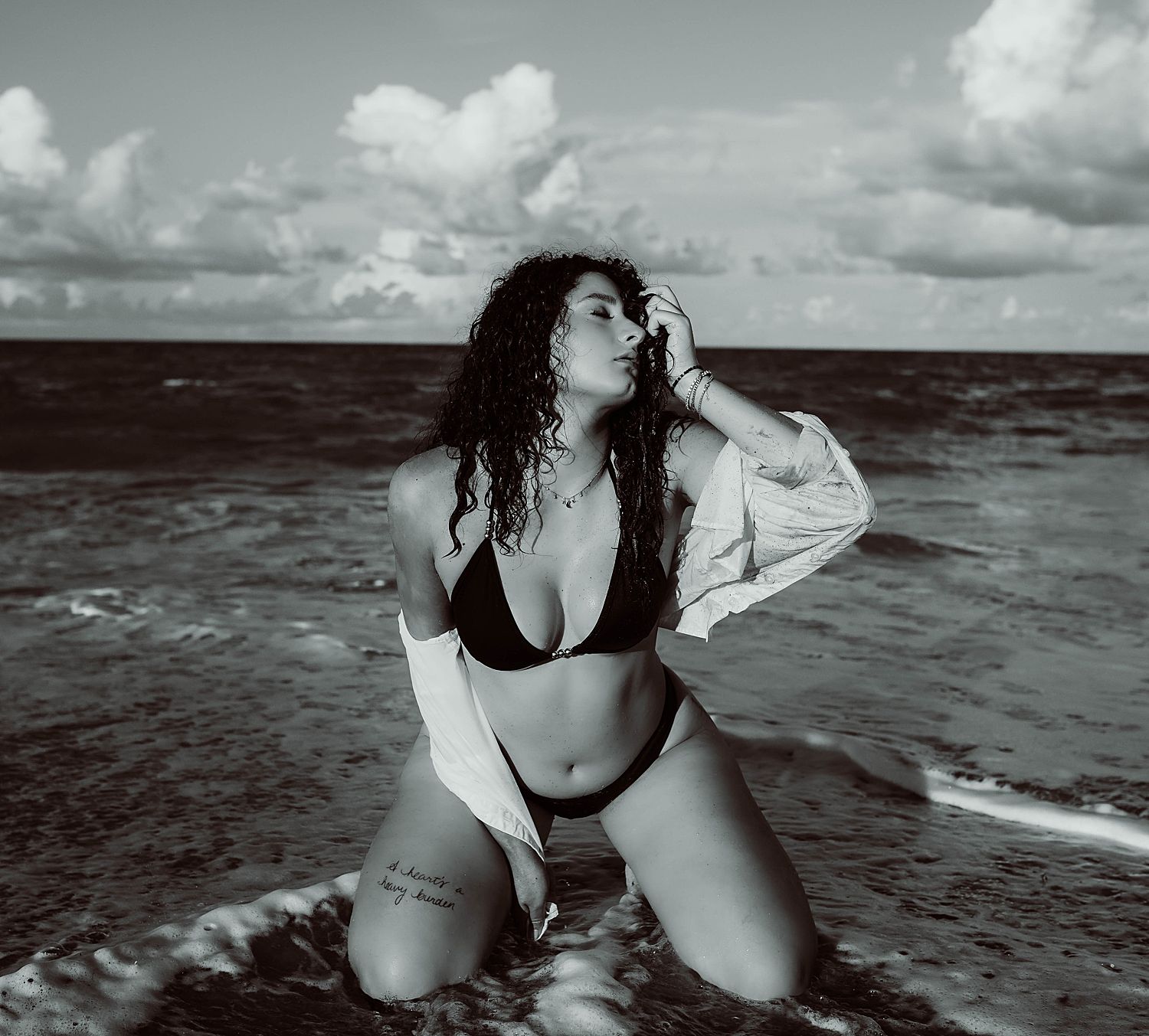 Black and white portrait of woman in a bikini for outdoor beach shoot