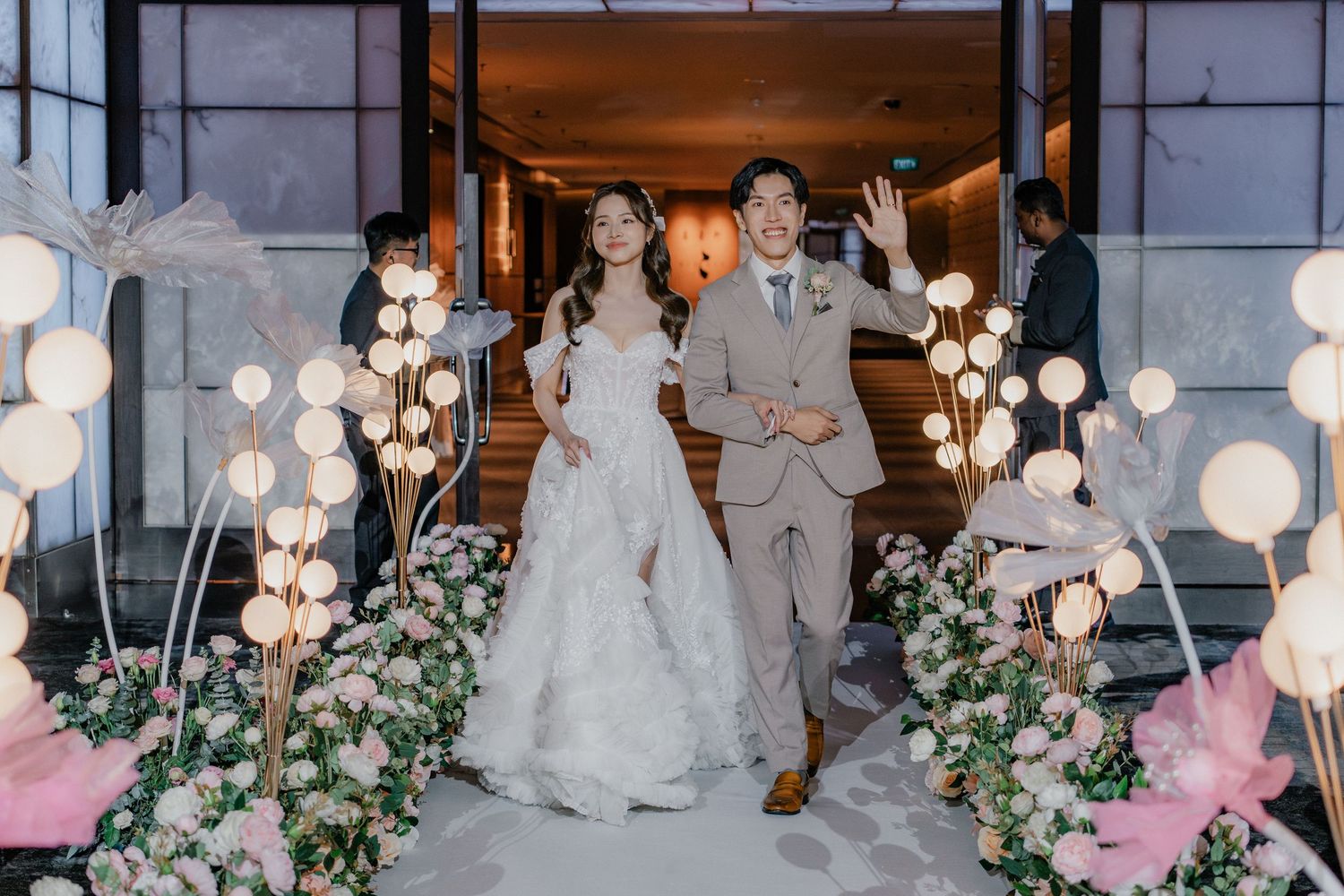 Wedding venue decorated with hanging lanterns and floral arrangements creating a magical atmosphere.