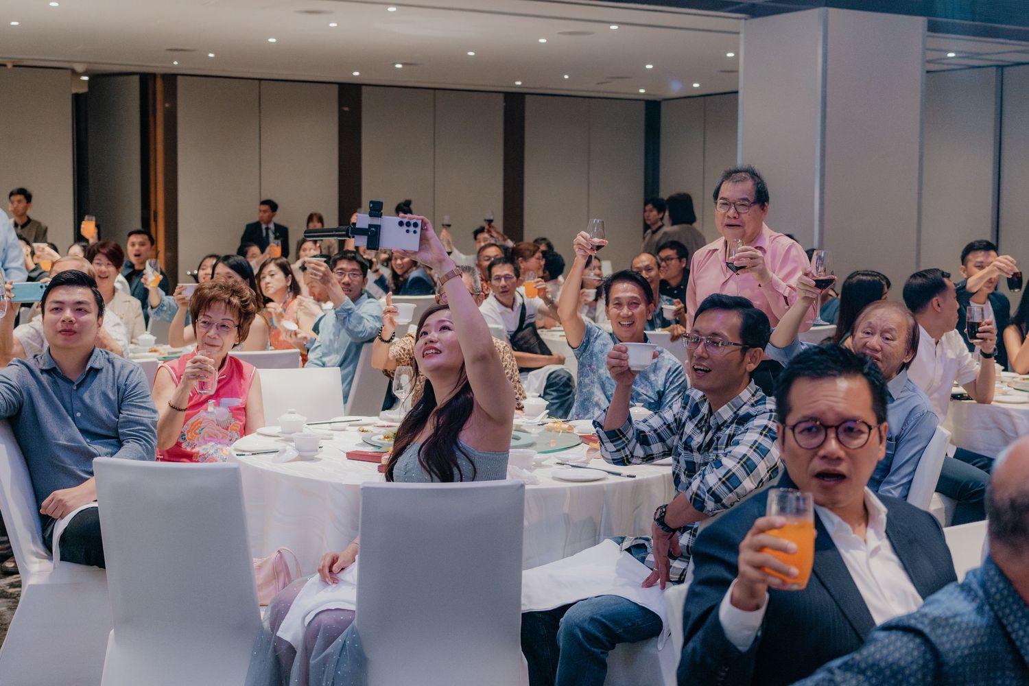 Wedding guests enjoying the reception festivities at decorated banquet tables.