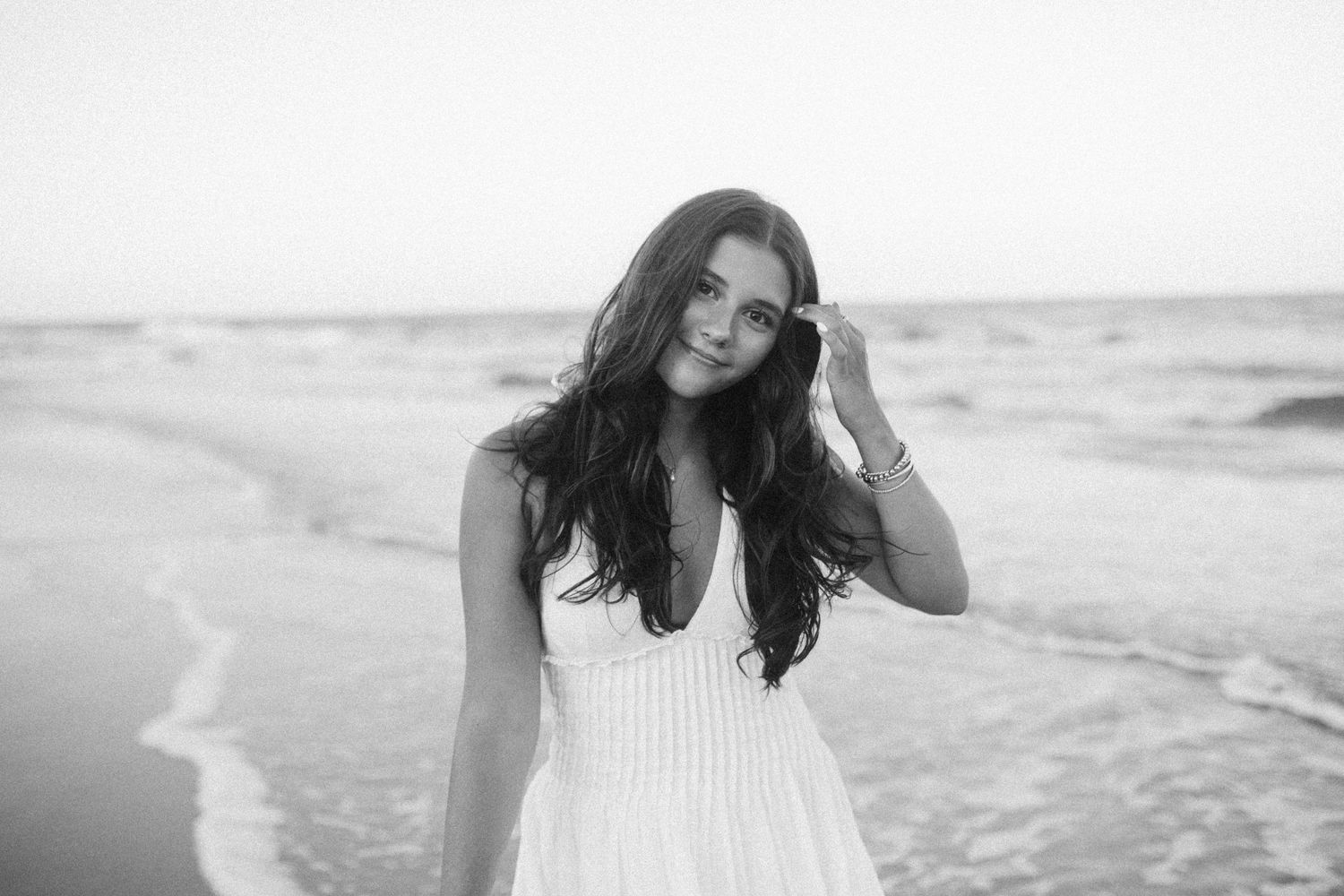 Black and white senior portrait by B. Logsdon at the beach on Hilton Head Island, South Carolina.