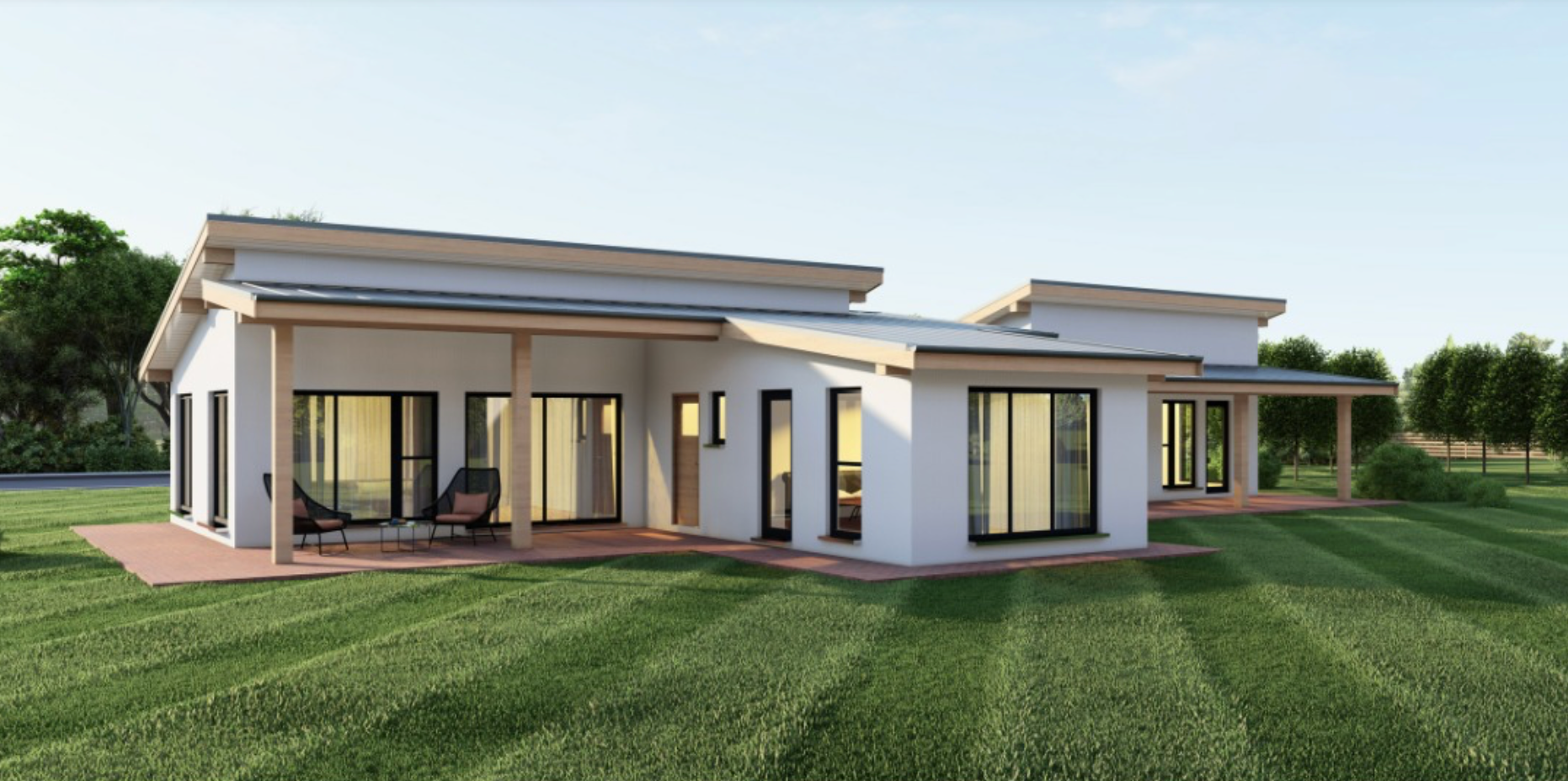 Modern single-story villa with large windows and clean lines set on a manicured green lawn.