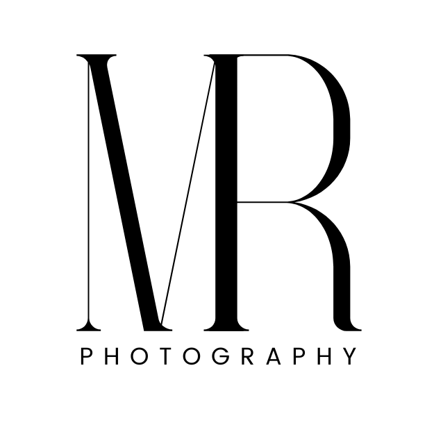 A plain black coffee mug against a stark black background creates a minimalist silhouette design.