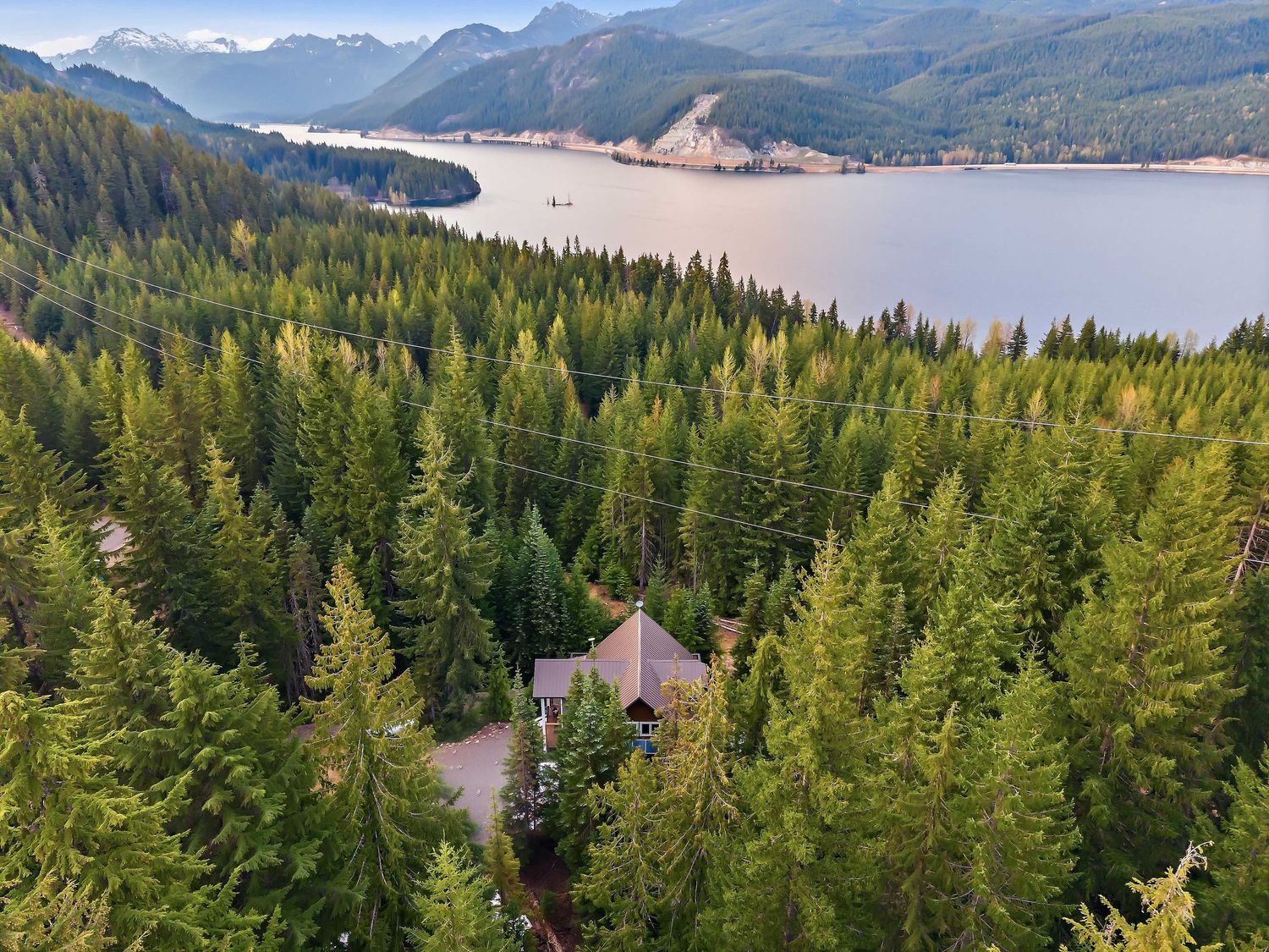 Drone shot of cabin and lake for drone real estate photography in Easton, Washington