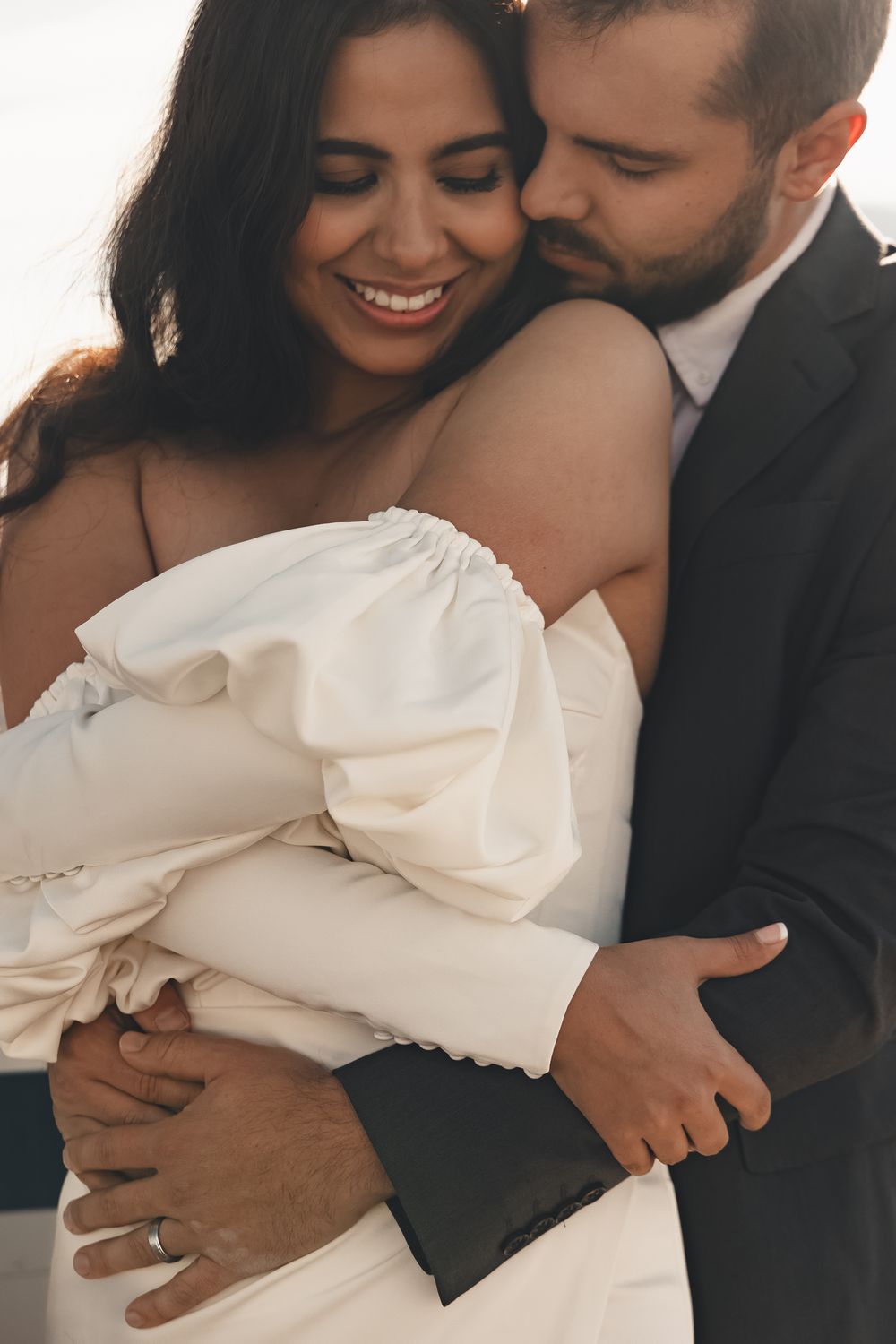 Golden hour engagement session at Nephi Municipal Airport in Utah — playful kisses, sun flares, and adventurous love on the runway.