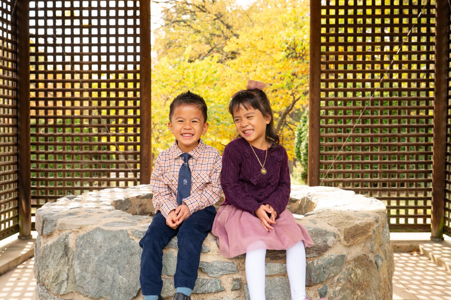 Candid sibling photo during family session in Northern Virginia by Sarah Thayer Photography. Second year I photographed this family