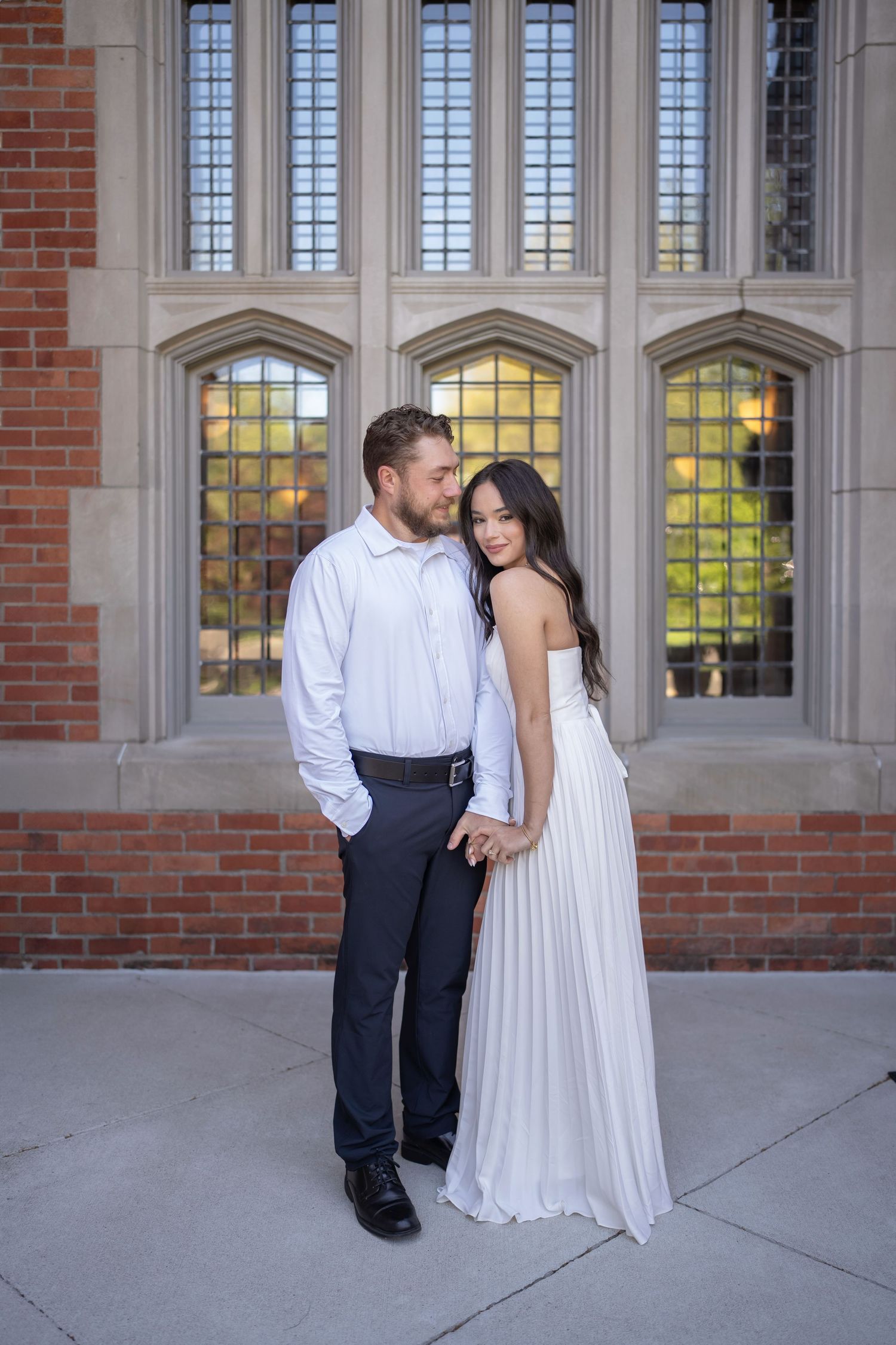 Couple in formal attire posing at Jeffrey Mansion for their Engagement Session