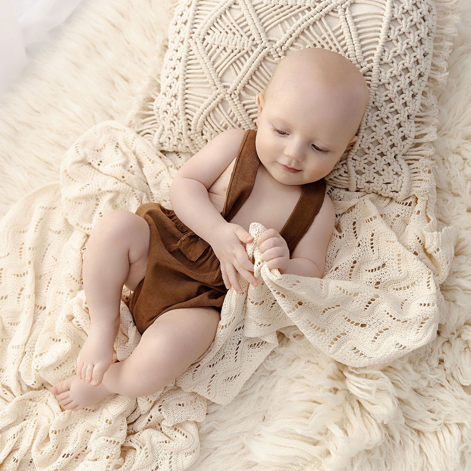 Little boy lying on a blanket at his sitter session in Coventry with Shelly Loxton Photography
