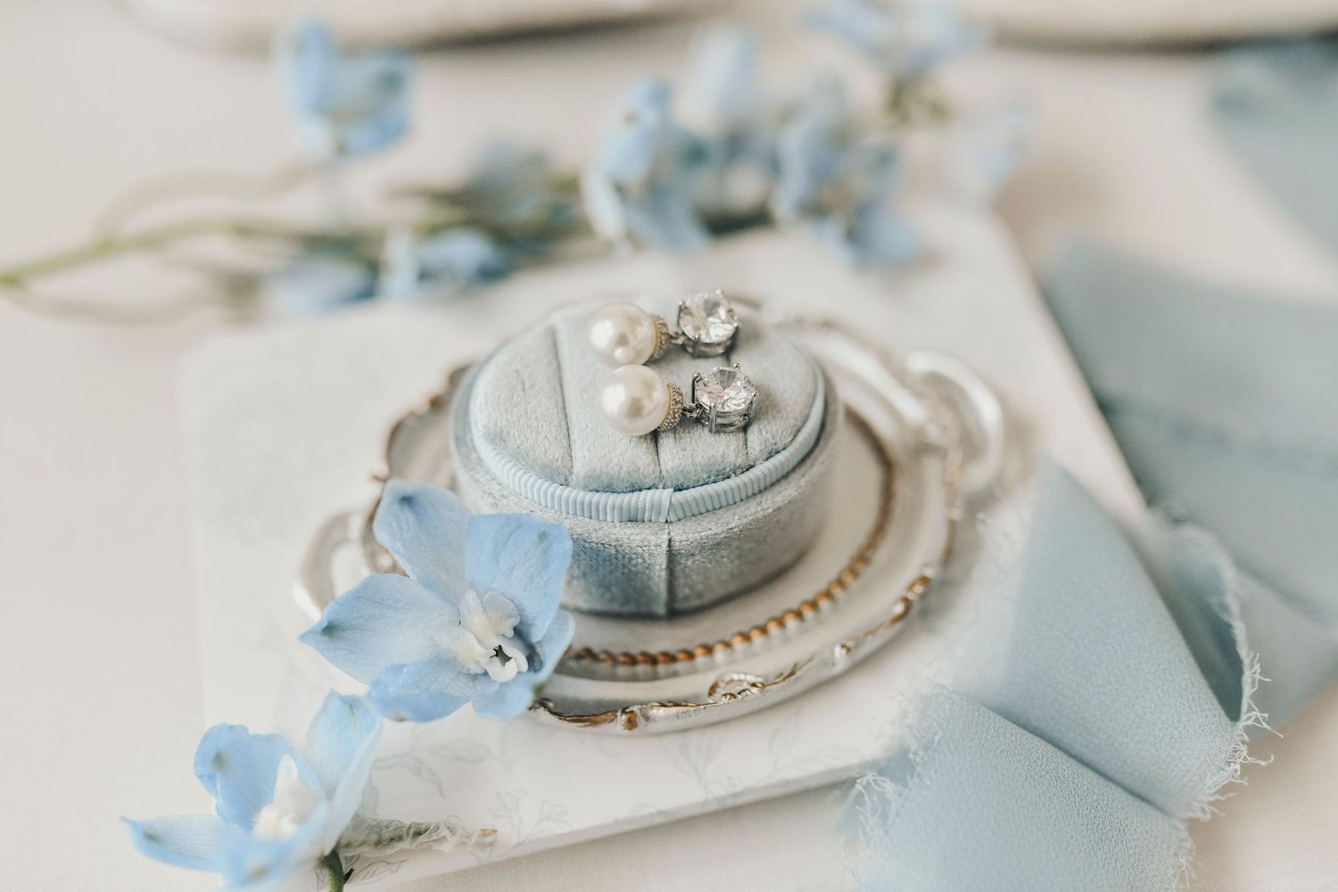 editorial wedding flat lay at The Gardenia with blue tones and soft natural light