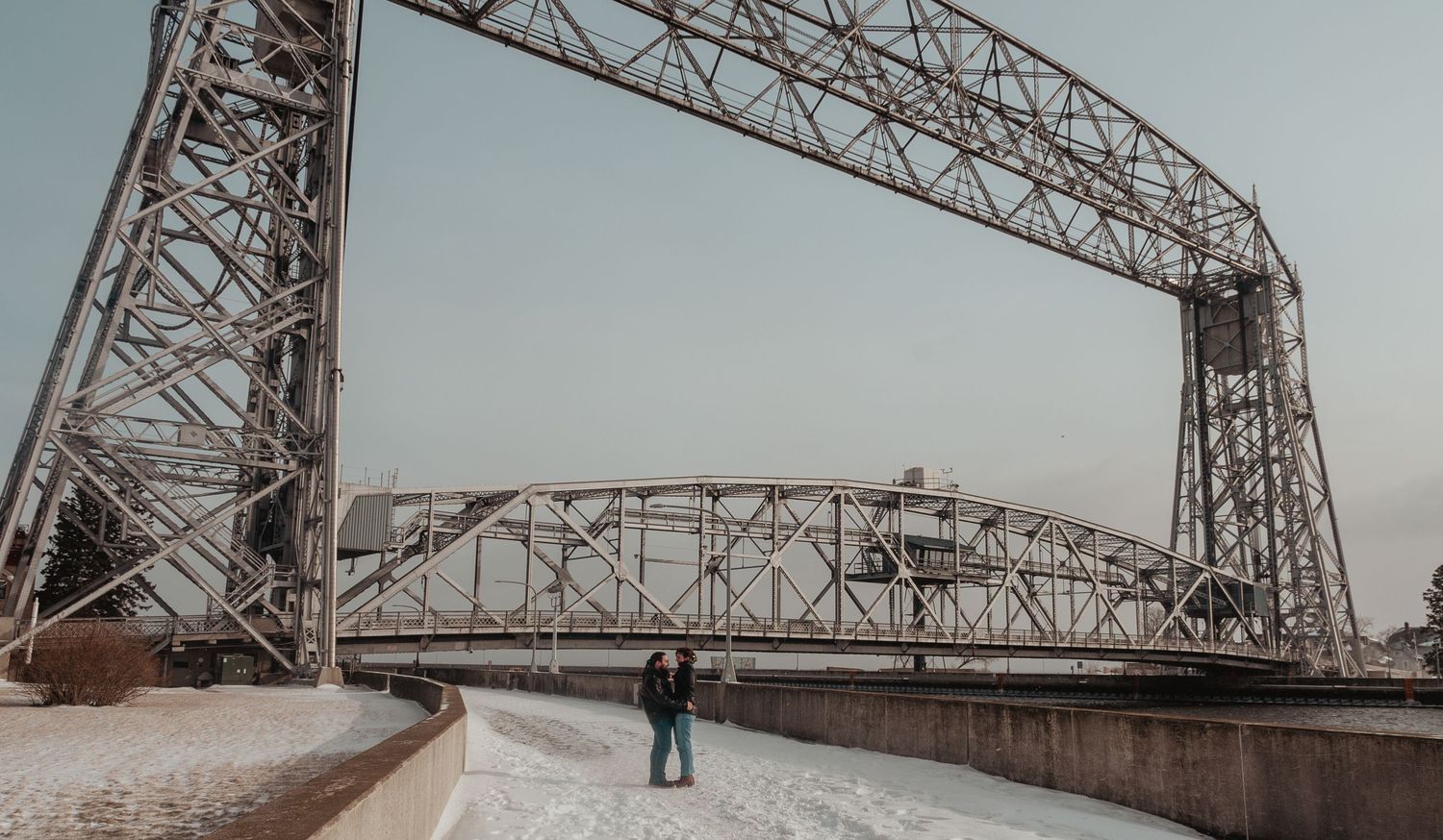 The Duluth Aerial Lift Bridge towers over a snowy winter landscape.