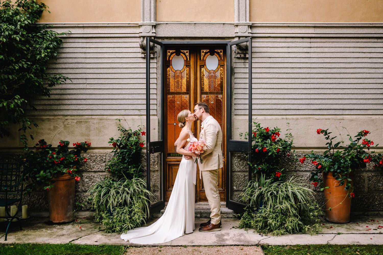 Finnish bride and groom during their romantic photo session in the lush hotel gardens