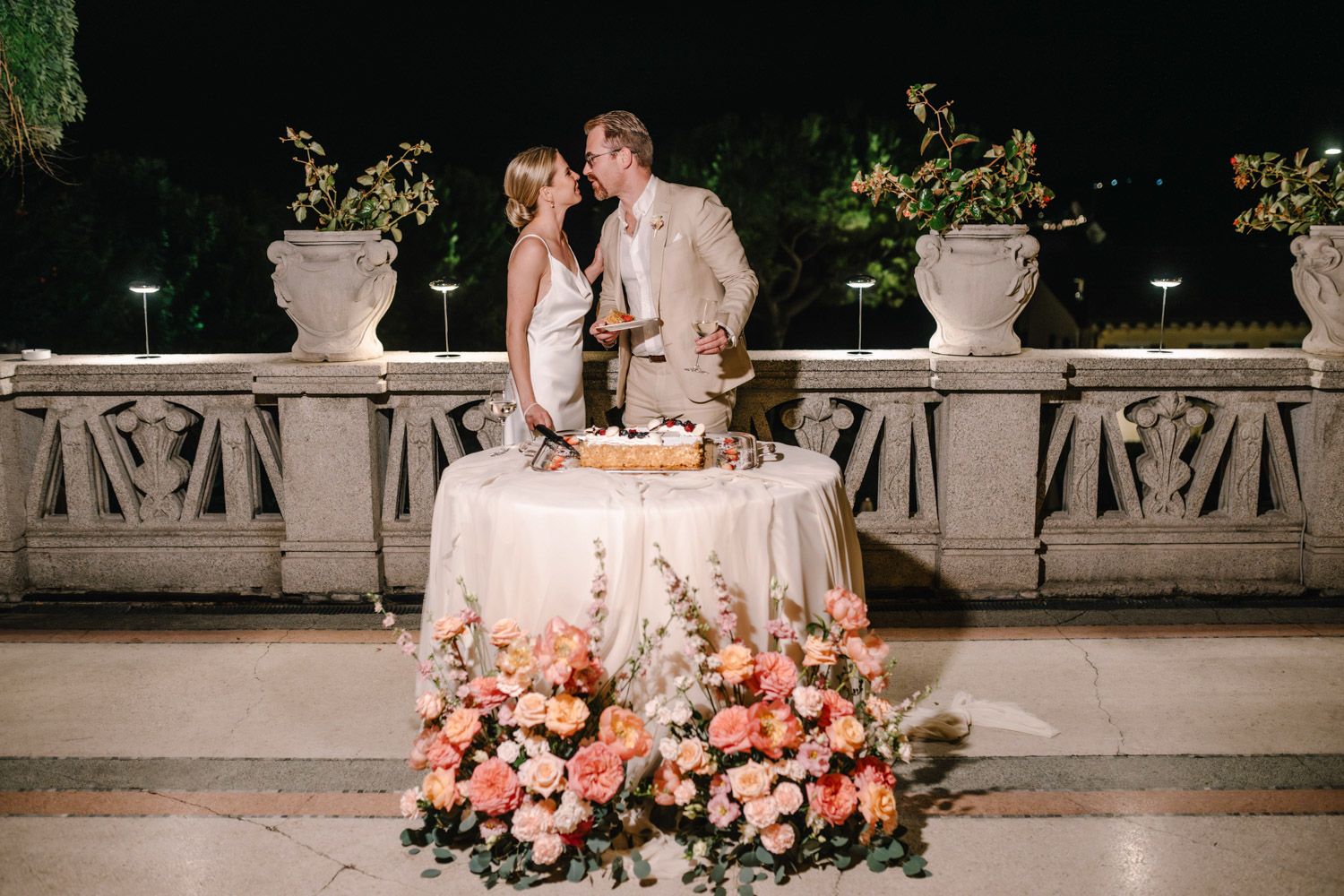 Wedding cake cutting at an Art Nouveau hotel overlooking Lake Garda