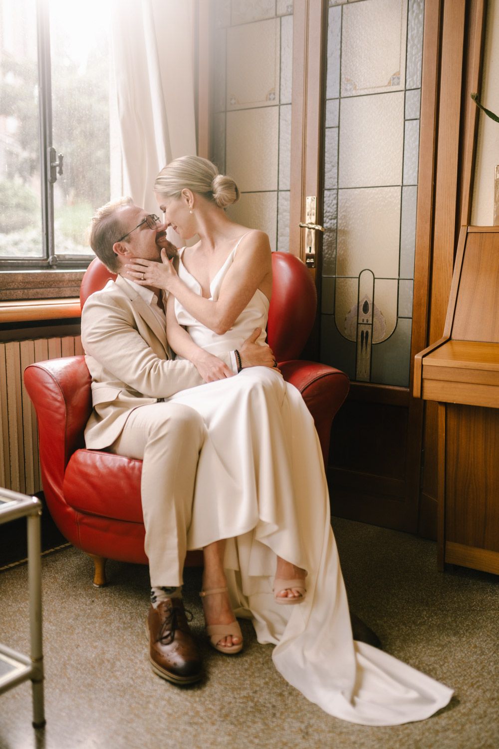 A romantic portrait of the newlyweds inside an elegant hall with vintage charm