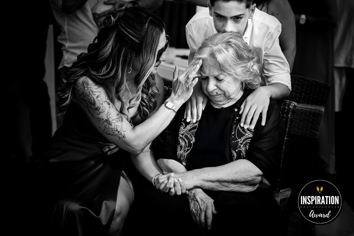 Black and white images showing close-up shots of tattooed arms and hands in various poses and interactions.