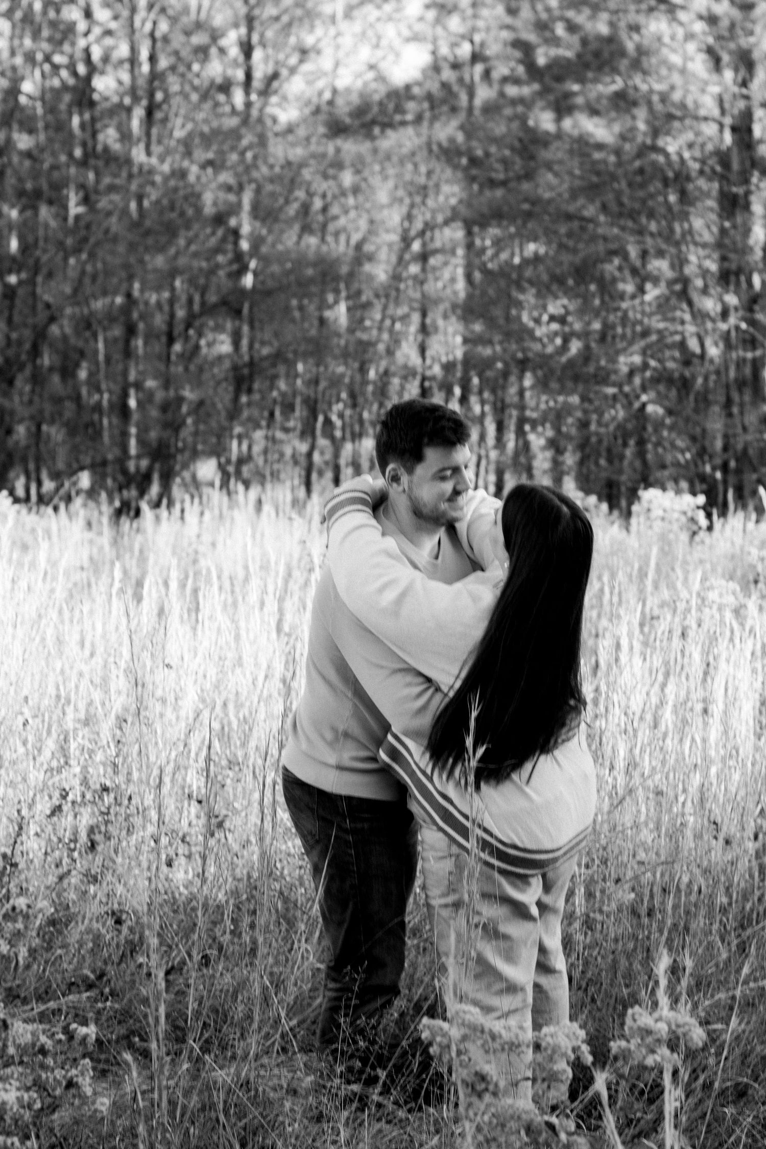 couple dancing in field