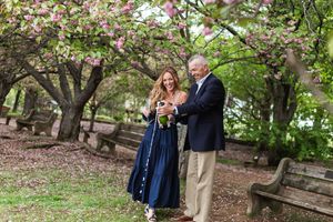 Series of candid moments captured under flowering cherry trees in a peaceful garden setting.