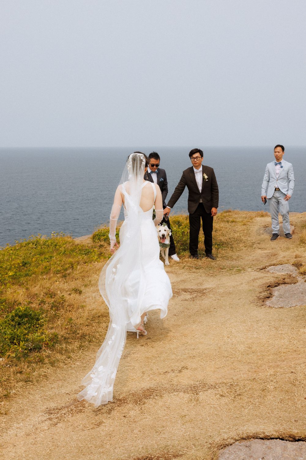 Wedding Ceremony at Torbay Point on the East Coast Trail captured by Newfoundland documentary style wedding photographer Kaitlyn yvette