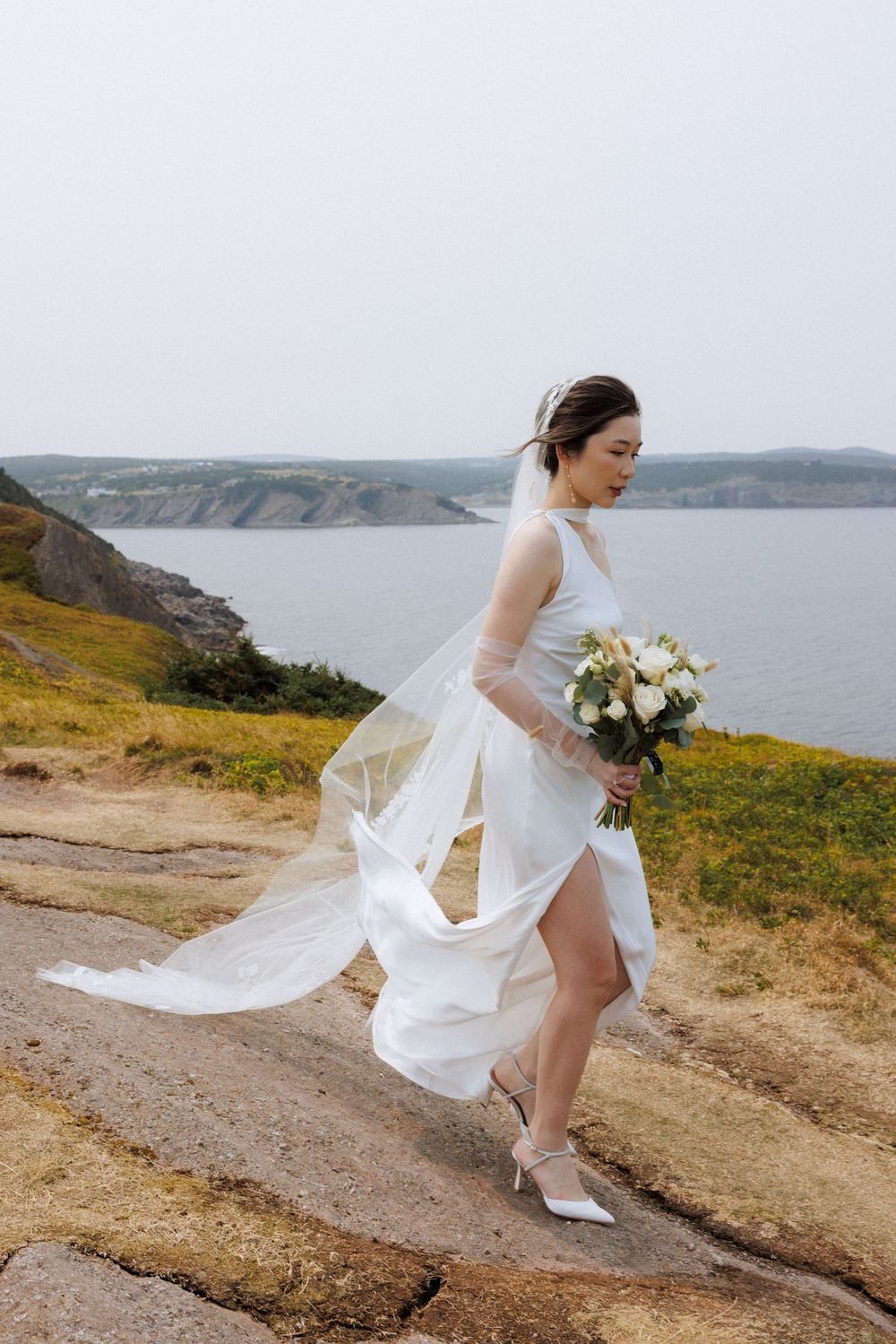 Wedding Ceremony at Torbay Point on the East Coast Trail captured by Newfoundland documentary style wedding photographer Kaitlyn yvette