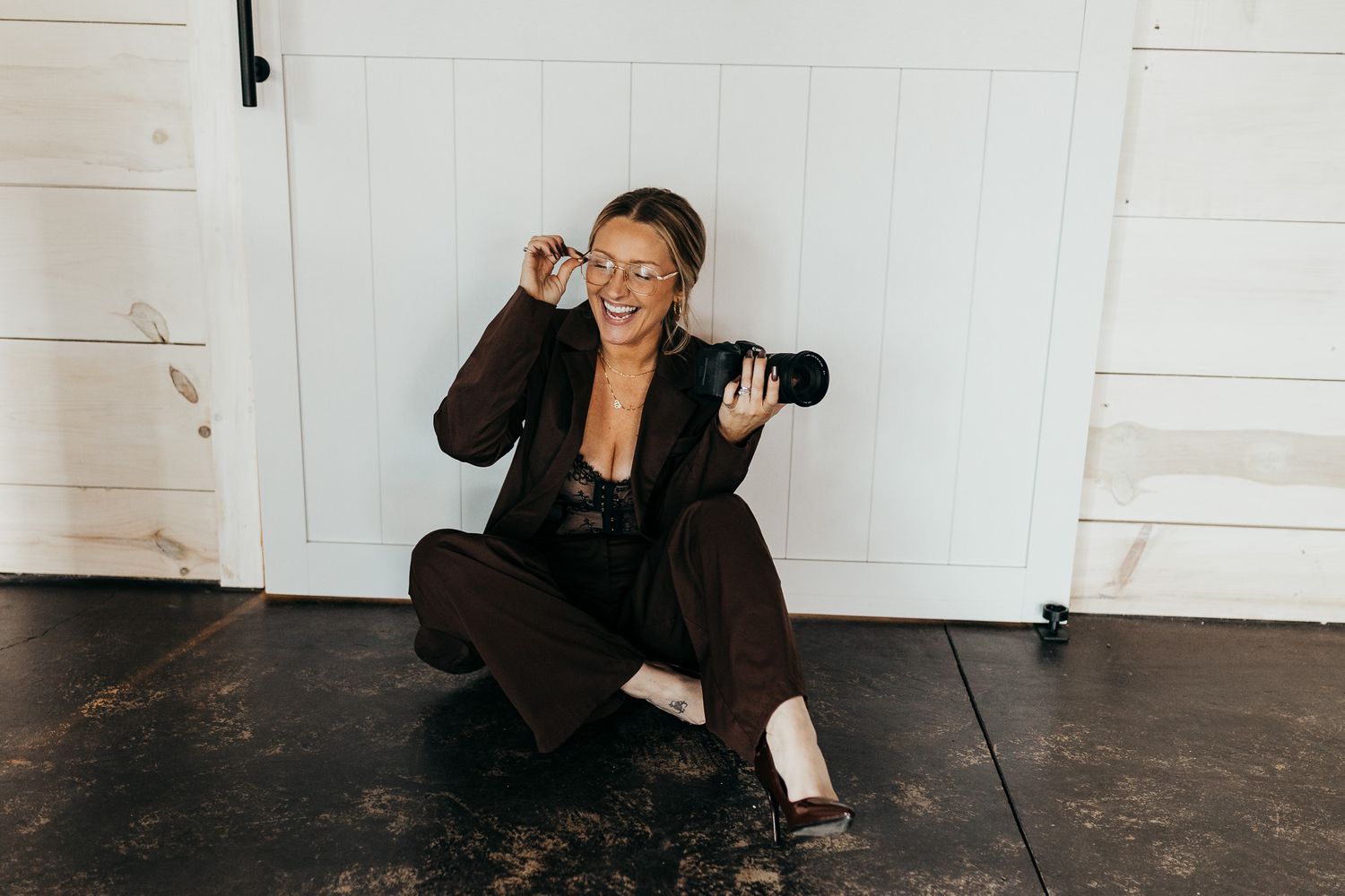People in motion create a blurred effect against white walls in an artistic dance or movement sequence.