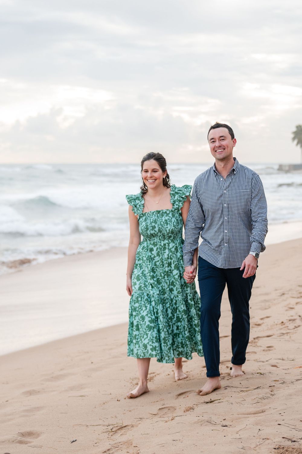 Couple standing together on shoreline during engagement photos in Condado Beach Puerto Rico