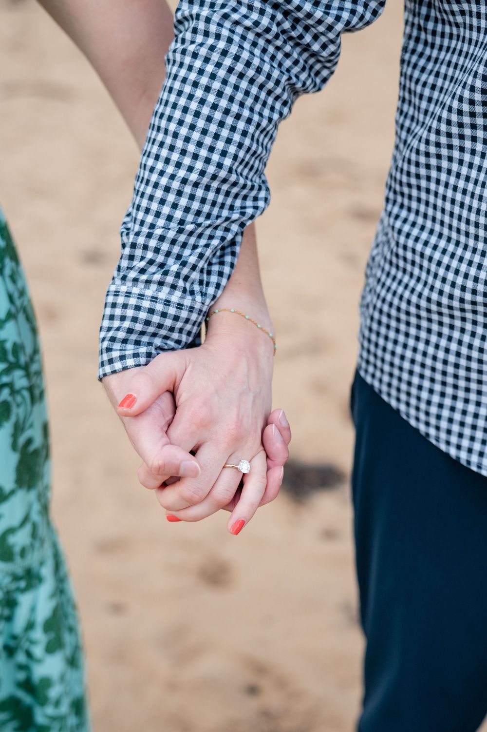 Close up of couple holding hands during beach engagement session in San Juan Puerto Rico