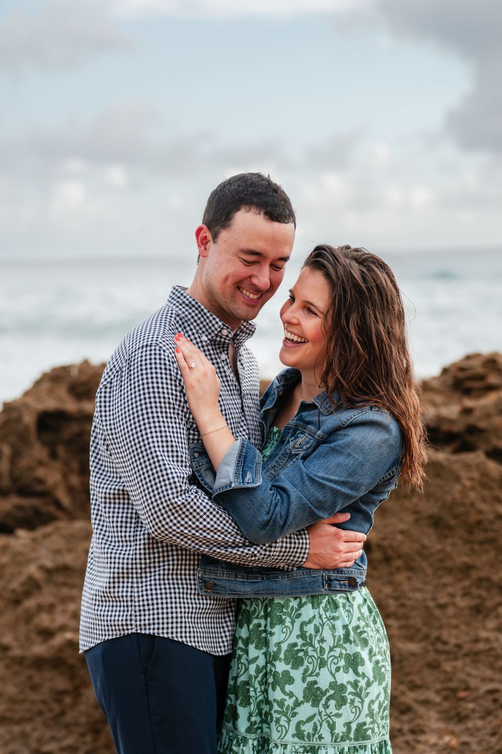 Couple embracing closely during engagement photos in Condado Beach San Juan Puerto Rico