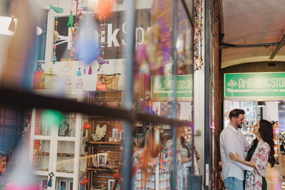 pre wedding photos in Lisbon LX Factory couple embracing inside colorful concept store