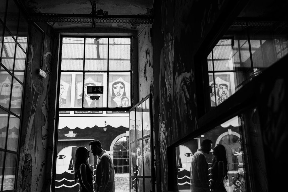 pre wedding photos in Lisbon LX Factory black and white silhouette couple in artistic corridor