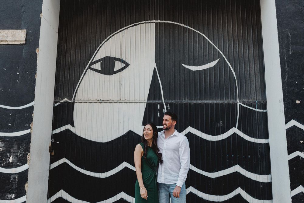 pre wedding photos in Lisbon LX Factory couple silhouette with graphic mural background