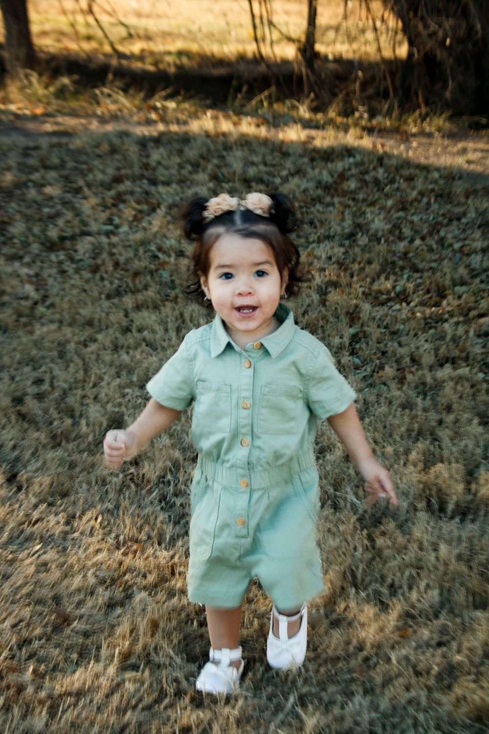 A toddler girl during an extended family photo session at The League House in Amarillo, Texas