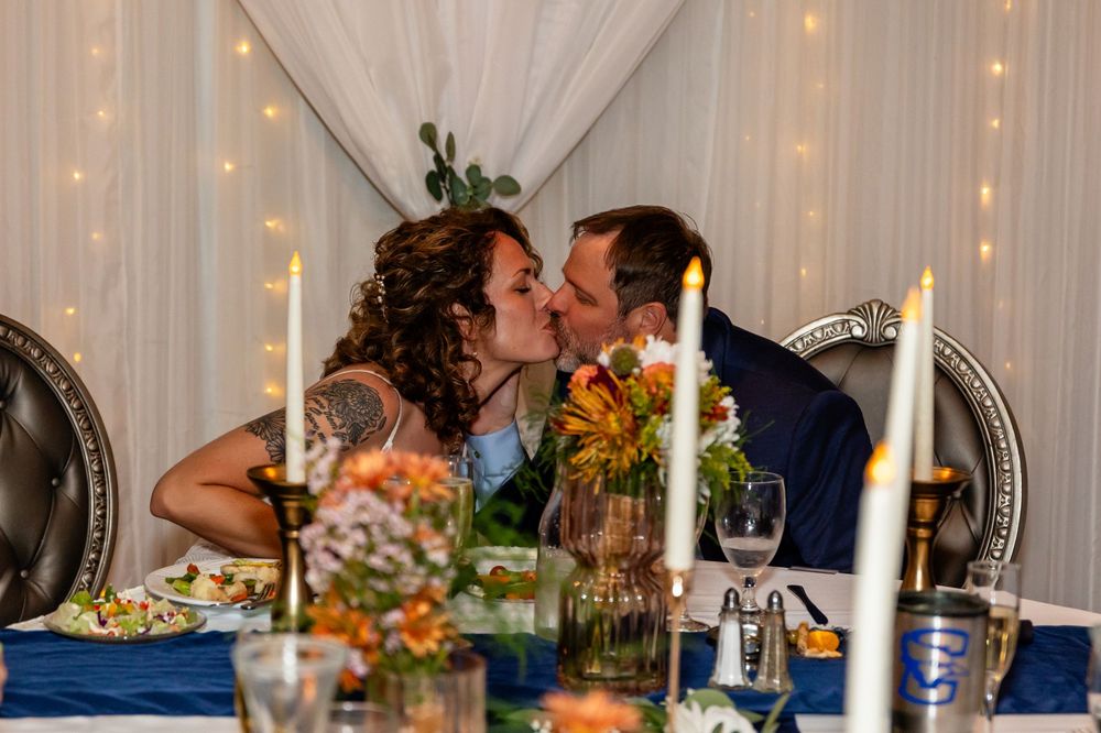 Newlyweds share a romantic kiss at their wedding reception at a Venue on the Ridge in Elkhorn NE